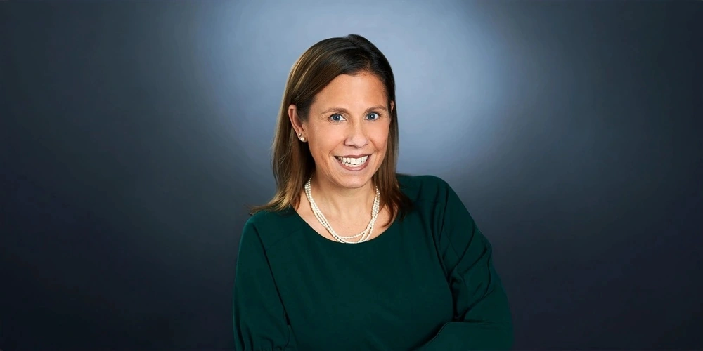 Professional studio headshot of Jacqueline DeChamps, Chief Operating Officer at Towne.